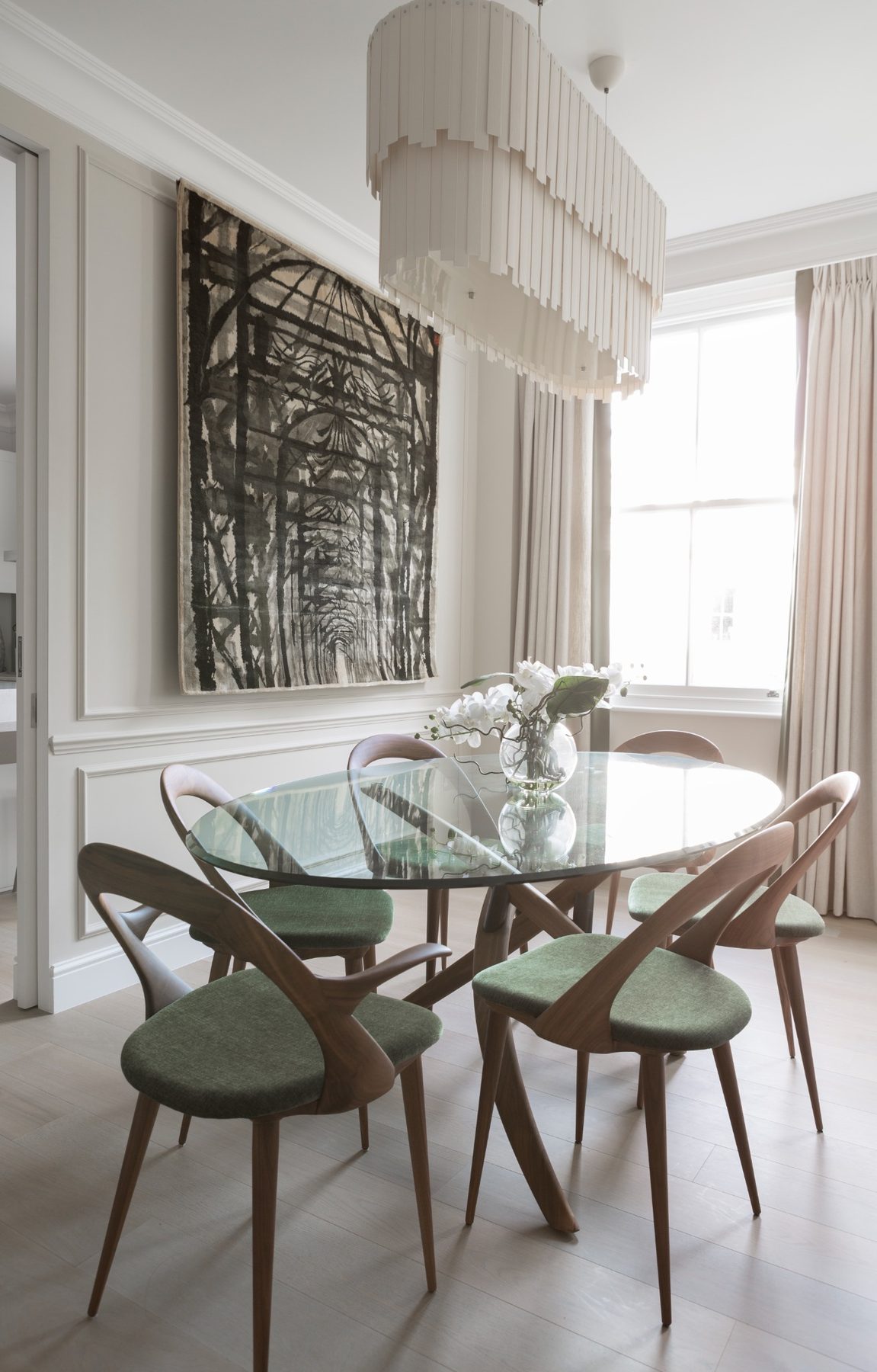 The dining room at Stanhope Gardens with artwork on the wall.