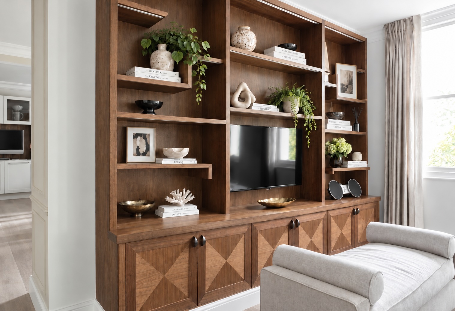 The bespoke walnut media unit at Stanhope Gardens.
